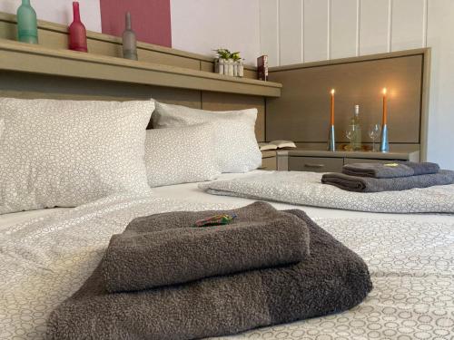 a bedroom with two beds with towels on them at Ferienwohnung Dünnebacke in Schmallenberg