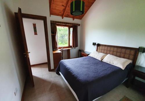 Cama ou camas em um quarto em Cabañas Normana Inn