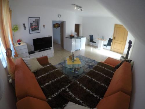 Posezení v ubytování Ferienwohnung Am Sonnenweg