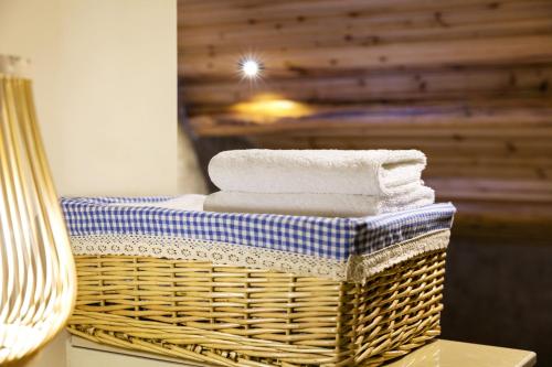 a wicker basket with towels on a table at Hangzhou Citynest Music B&B in Hangzhou