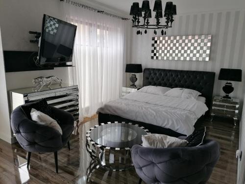 מיטה או מיטות בחדר ב-Apartamenty De Soleil