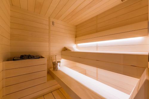 a sauna with wooden walls and wooden floors at Rocca Riviera Umag Luxury Apartments in Umag
