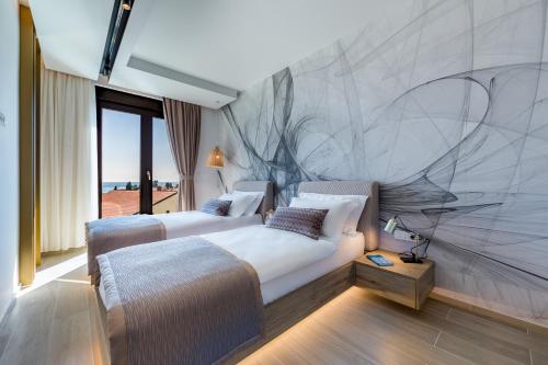 Krevet ili kreveti u jedinici u objektu Rocca Riviera Umag Luxury Apartments