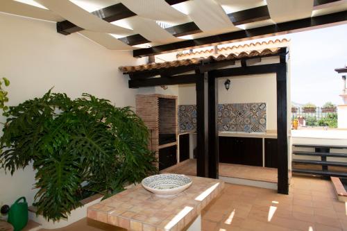a living room with a patio with a table at Feudo Giglio Country Charme in Calatafimi