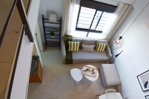 an overhead view of a living room with a couch and a window at Letmalaga Economy Jábega in Málaga