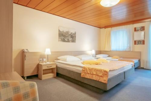 Ein Bett oder Betten in einem Zimmer der Unterkunft Garni Hotel Miklič
