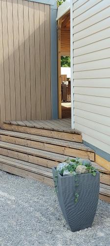 a planter sitting on the side of a porch at PP-Camping Wallersee in Seekirchen am Wallersee