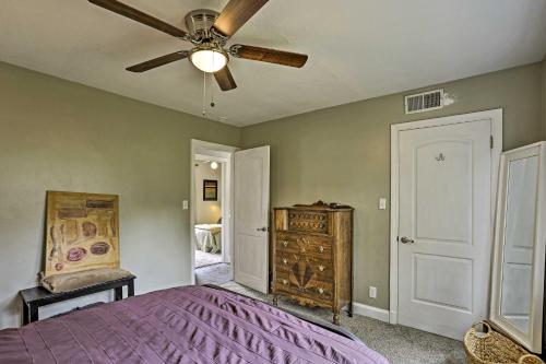 a bedroom with a purple bed and a ceiling fan at Family-Friendly Escape about 6 Mi to City Center! in Chattanooga