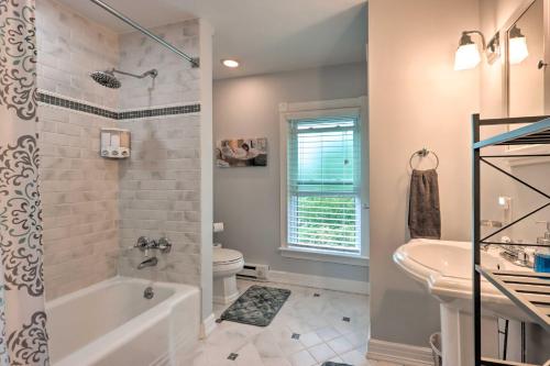 A bathroom at Charming Abode with Patio - Walk to Town and River!