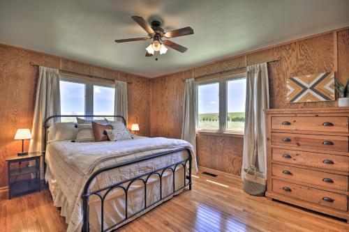 a bedroom with a bed and a ceiling fan at The Front Porch 20-Acre Country Home with Mtn View in Red Lodge