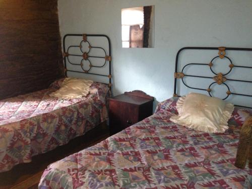 Ένα ή περισσότερα κρεβάτια σε δωμάτιο στο Albergue ESCANLAR