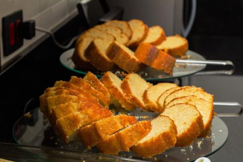 two plates of breads sitting on top of an oven at Hotel Estação Paraíso - ao lado do Metrô Paraíso e 600m da Av Paulista in Sao Paulo