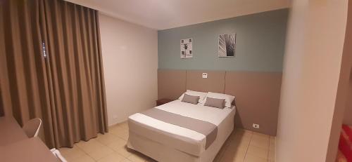 Ένα ή περισσότερα κρεβάτια σε δωμάτιο στο Liv Hotel
