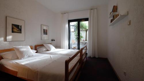 Postel nebo postele na pokoji v ubytování Apartmani Anita