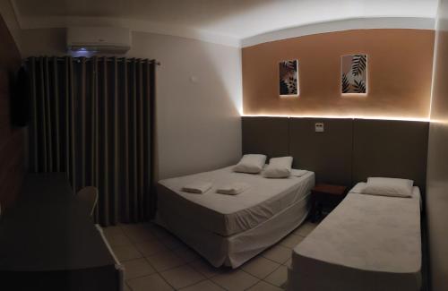 Ένα ή περισσότερα κρεβάτια σε δωμάτιο στο Liv Hotel