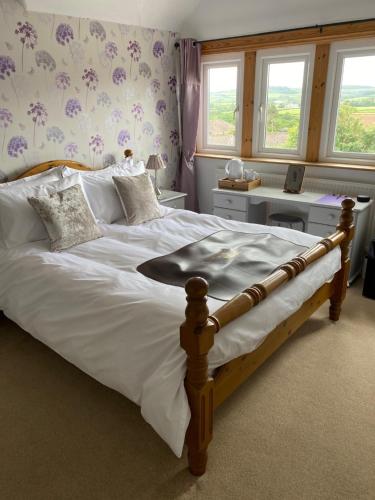 เตียงในห้องที่ Birtley House Bed and Breakfast