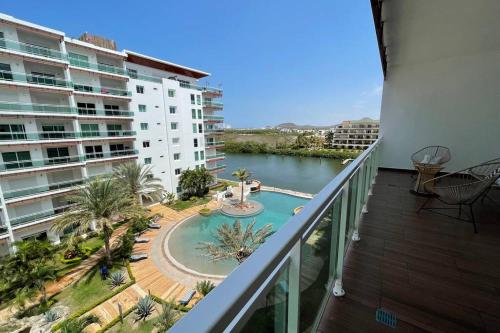 a balcony with a view of a body of water at 5010 depa Pacifika de lujo en Marina Mazatlán in Mazatlán