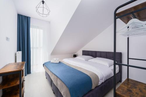 Postel nebo postele na pokoji v ubytování Apartamenty Bellamaya - Kapitanska 18