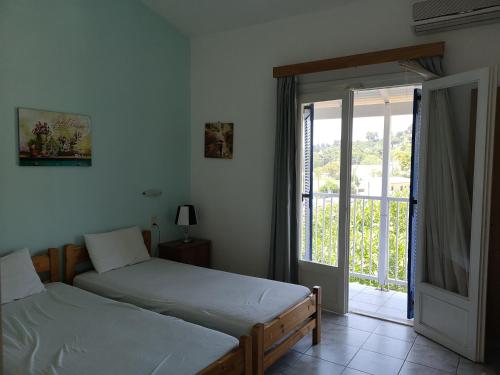 Postel nebo postele na pokoji v ubytování Drosia apartments