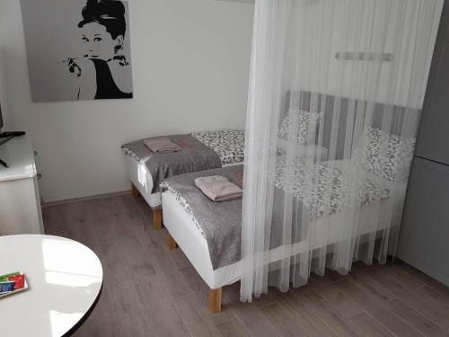 En eller flere senger på et rom på Guesthouse Henia Bed&Spas