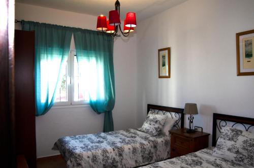 Postel nebo postele na pokoji v ubytování Zapata Home