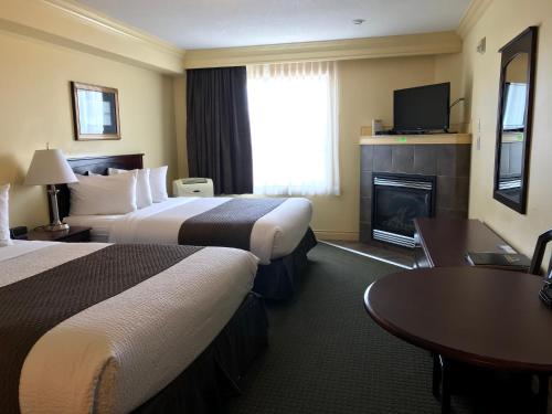 Кровать или кровати в номере Quality Inn & Suites