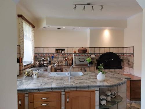 A kitchen or kitchenette at Charming village house with patio and garden