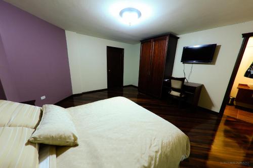 Ένα ή περισσότερα κρεβάτια σε δωμάτιο στο Hotel Spa Casa Real