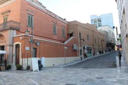 an empty street in a city with buildings at La casa di Rosy in Matera