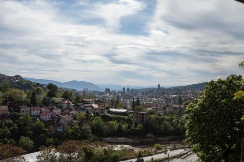 a view of a city from a hill at Guest House LIKE in Sarajevo