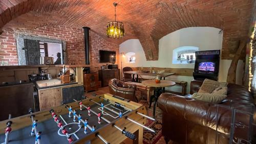 a living room with a couch and a table at Apartmány Na Návsi 19 u Hluboké in Hrdějovice