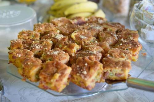 a pile of food on a glass plate with bananas at Porto Abraão Pousada in Abraão