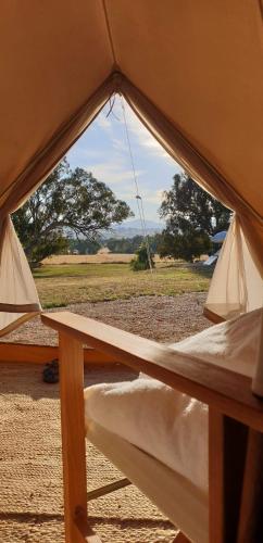 an open tent with a view of a field at Mansfield Glamping - ADULTS ONLY in Mansfield