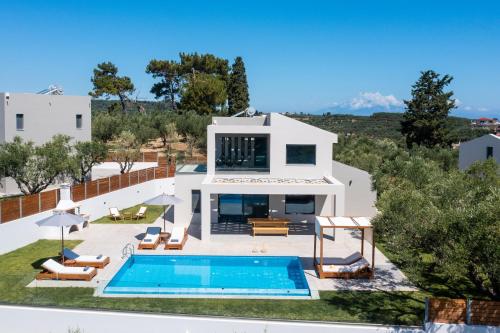 an aerial view of a house with a swimming pool at Villa Plumeria in Tsilivi