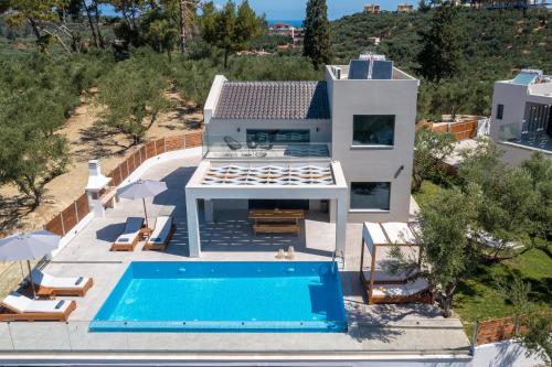 an aerial view of a house with a swimming pool at Villa Plumeria in Tsilivi
