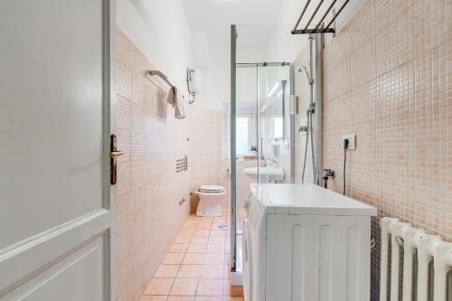 a bathroom with a white sink and a toilet at La casa di Andrea ai Musei Vaticani 1 in Rome