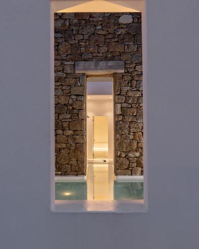 a framed picture of a refrigerator in a brick wall at Villa Maera Maximus in Mikonos