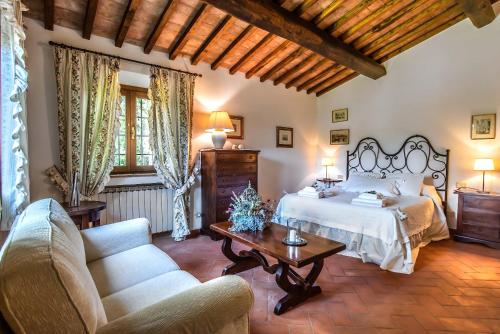 Postel nebo postele na pokoji v ubytování Il Torrino Country Resort