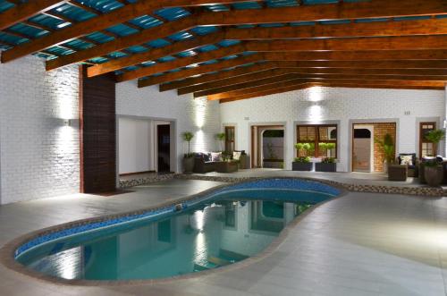 a swimming pool in the middle of a house at Yalla Yalla Boutique Hotel in Witbank