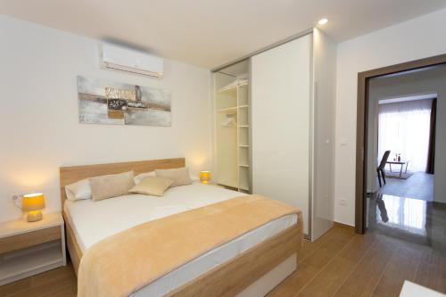 Postel nebo postele na pokoji v ubytování Apartments Vicin