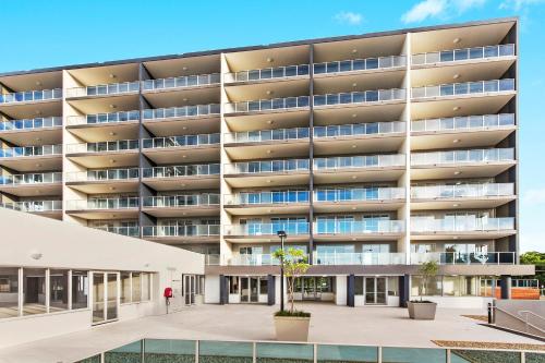 an external view of a large apartment building at Allure Hotel & Apartments in Townsville