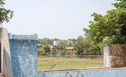 a view from the balcony of a house at Triose Boutique Hotel Lonavala in Lonavala