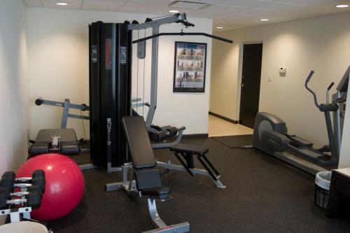 a gym with treadmills and exercise balls and machines at Peninsula Island Resort & Spa - Beachfront Property at South Padre Island in South Padre Island