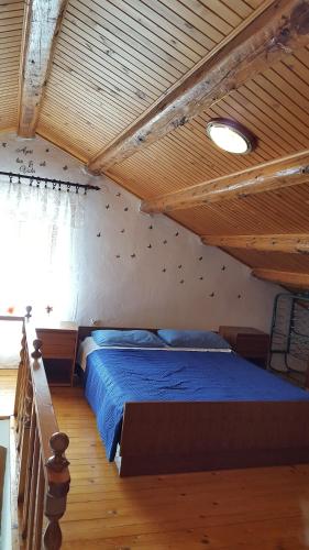 Postel nebo postele na pokoji v ubytování Apartmani Milenko Lubenice