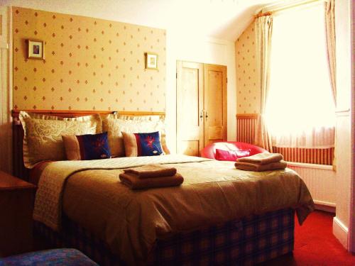 Un ou plusieurs lits dans un hébergement de l'établissement The Norman Guest House