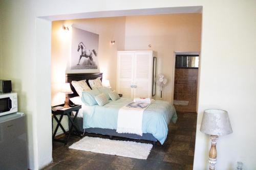 Katil atau katil-katil dalam bilik di Panda's Guest Cottages