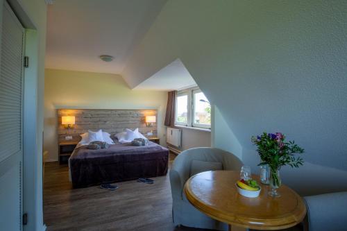 Postel nebo postele na pokoji v ubytování Hotel MeerLand Pellworm