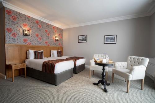 En eller flere senge i et værelse på Whittlebury Hall and Spa