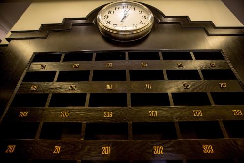a clock on the side of a building at Manhattan Business Hotel Damansara Perdana in Petaling Jaya
