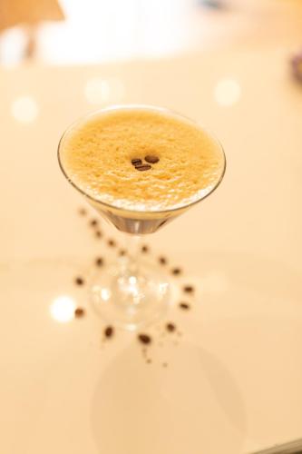 a wine glass filled with coffee on a table at Rufford Arms Hotel in Rufford